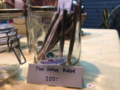 Mamaweed, Lampang: Close-up of pre-rolled Thai Sativa cannabis joints in a jar. Lampang weed shop.