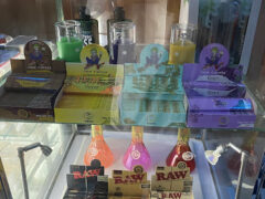 Display case inside Natural Power in Nonthaburi, with rolling papers, smoking accessories and bongs.