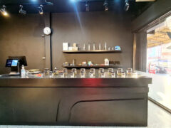 Interior of NeatWeed cannabis shop in Hua Mak, Bangkok, showcasing flowers and accessories.
