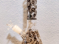 Glass bong with skull design, smoking accessory at Northland Cannabis, Phayao, Thailand.