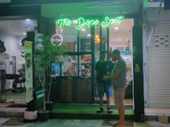 Exterior of Phuket High Fishing Village in Rawai, Phuket, with neon 
