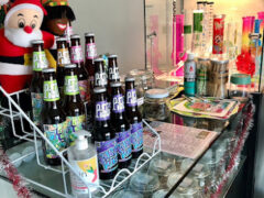 PIGCOLOSHOP in Phra Pradaeng District, Samut Prakan, showing cannabis flower jars, bongs, and bottles.