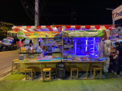 Poom Cannabis shop in Jomtien, Chonburi, Thailand, selling cannabis flower and accessories, with a street-side setup.