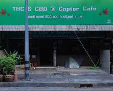 QQQNBR Thc&CBD CopTer Cafe exterior in Nonthaburi, Thailand. Cannabis dispensary with smoking accessories.