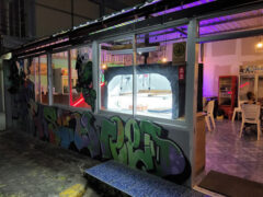 Exterior of SEA-SUN&WEED cannabis shop in Ko Chang District, Trat, with graffiti art, offering flowers and accessories.