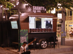 Shawty Need Buds cannabis dispensary in Khon Kaen, Thailand. Cannabis flower and smoking accessories in a trailer shop.