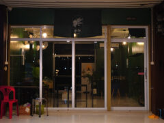 Exterior of Sukjai dispensary in Nakhon Ratchasima, Thailand, showing front entrance with cannabis logo.
