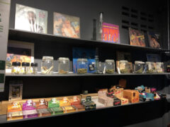 Interior display at wC Marizena Cannabis Store in Pak Kret, Nonthaburi, showing cannabis flower and smoking accessories.