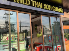 Wild Thai Koh Chang cannabis shop exterior, Ko Chang, Thailand. Playful decor with Hulk figure and red car visible.