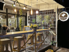 Wild Weed cannabis shop, Chiang Mai. Exterior view showing bar seating & flowers. Cannabis flowers & accessories available.