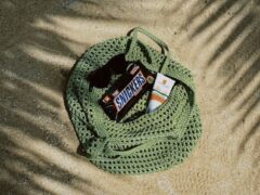 Cannabis-infused Snickers bar in a green tote bag, Rawai, Phuket, Thailand. Weed edibles at Cannabis Factory.