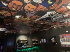 Dope Dealer cannabis shop interior, Koh Chang, Thailand, showing cannabis flower strains and ceiling mural.