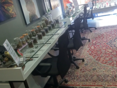Greeenfields dispensary interior, Hua Hin, Thailand. Jars of cannabis flower on display. Weed shop.