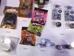 Cannabis edibles, smoking accessories, and cannabis whiskey at Greeenfields dispensary, Hua Hin, Thailand.