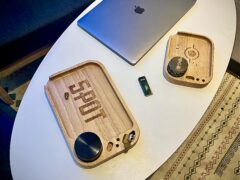 Wooden rolling tray with SPOT logo, grinder, and laptop.