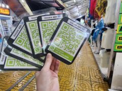 Order 420 QR code signs for Phi Phi Island cannabis shop, Thailand, with nearby shops and advertisements.