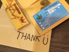 Cannabis flower, rolling papers, and 