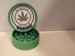 Green cannabis grinder with 