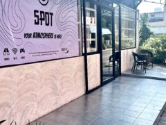 Exterior of SPOT cannabis shop in Pattaya, Thailand, with signage and seating area.