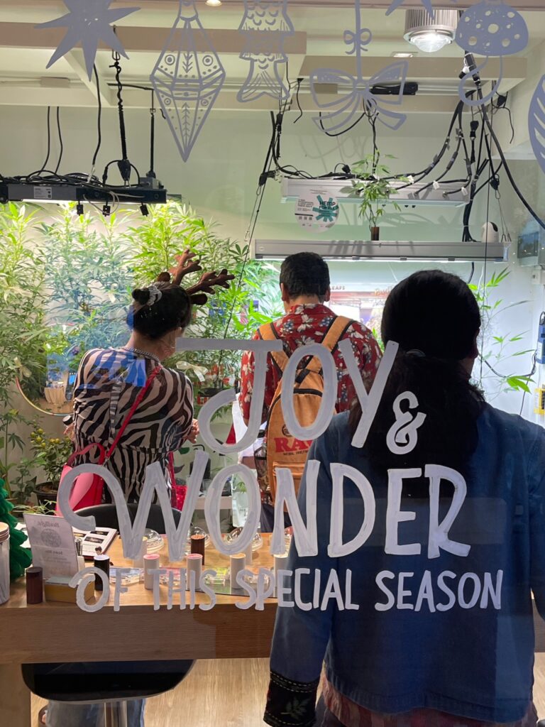 People browse a cannabis shop with 