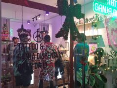 Exterior of Harmony Herb in Pattaya, Thailand, a cannabis dispensary with tattoo services on Walking Street.