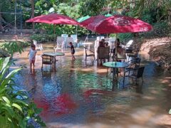 People enjoy riverside setting at Chief Weed Dispensary, Mae Rim, Chiang Mai, Thailand.