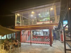 Exterior of DEEZBUDZ in Pratumnak, Pattaya, Thailand, with outdoor seating and red-and-black checkered bar area.