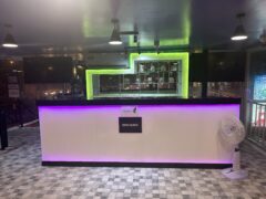 DEEZBUDZ dispensary interior, Pratumnak, Pattaya, with purple lighting and counter.