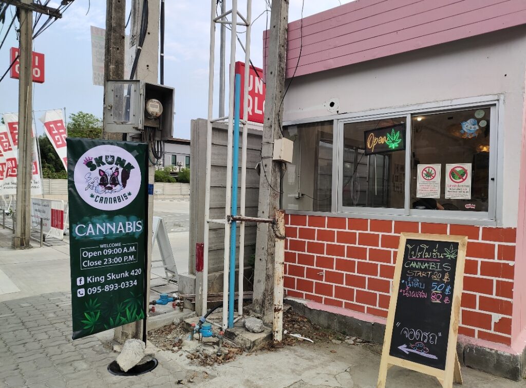 Cannabis shop exterior with signage, including an 