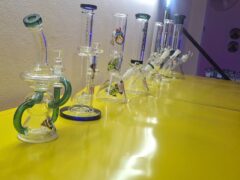 Bongka.BKR dispensary in Lat Phrao, Bangkok, showing various smoking accessories, including glass bongs, for cannabis.