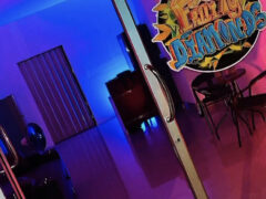 Fruity Diamonds cannabis shop in Hat Yai entrance, with logo on door, colorful lighting, and interior seating visible.