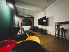 Interior of Channel Weed Store Saphan Khwai cannabis lounge in Bangkok with seating and TV.