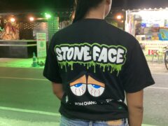 Woman wearing a Stone Face Koh Chang shirt in Kai Bae, Koh Chang, Thailand.