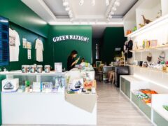 Green Nation Dispensary interior, cannabis shop in Saphan Sung, Bangkok, Thailand, with products on display.
