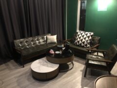 Interior lounge area at Green Nation Dispensary in Bangkok, with seating and coffee tables.