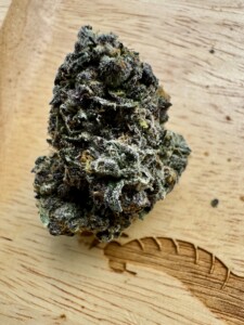 Cannabis bud on a wood surface.