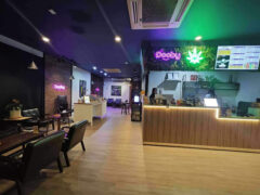 Interior of Dooby cannabis shop in Bang Chak, Bangkok. Check-in counter and seating area. Thailand weed dispensary.