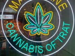 Neon sign for Mary Jane cannabis shop on White Sands Beach, Ko Chang, Thailand. 